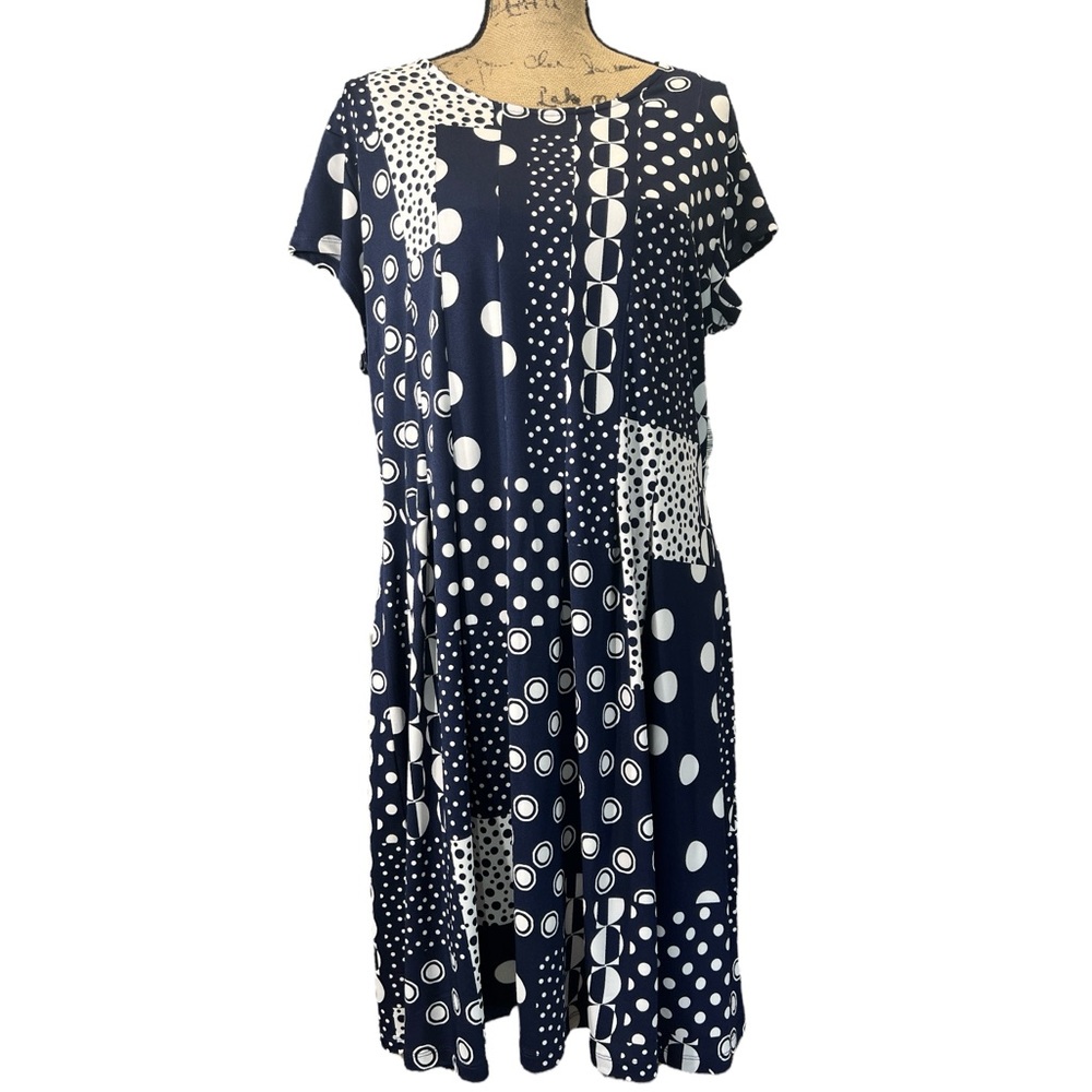 "N Touch" dress with patchwork design, various navy and white polka dot patterns